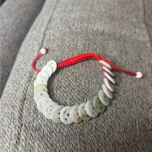 Elegant Jade Disc Bracelet with Red Cord